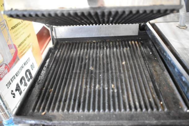 Sirmann stainless steel double panini press, 208 volts, 1 phase, ribbed plates, used condition.