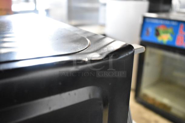 Walmart EM720C2WT-PM Countertop Microwave Oven with visible dent. 120 Volts, 1 Phase. Includes plate.