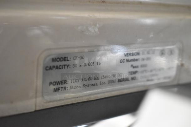 CK-30 Countertop Scale label, showing model, capacity (30 x 0.005 lb), 110V AC power, by Atron Systems, Inc.