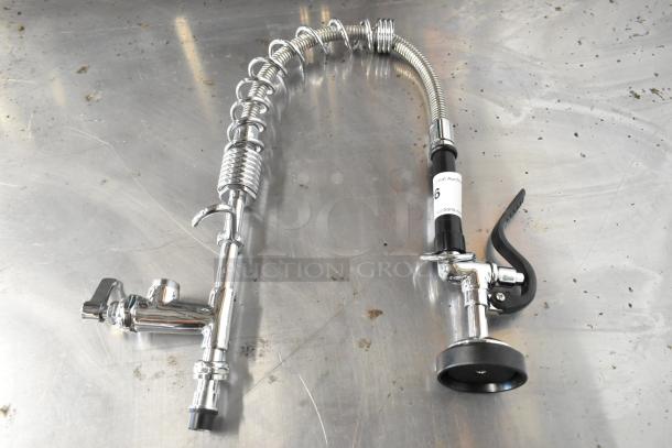 Metal spray nozzle attachment with chrome finish, flexible hose, and ergonomic handle. Appears in excellent condition.