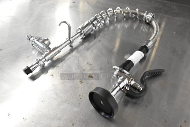 Chrome metal spray nozzle attachment with coiled hose, ergonomic grip, and adjustable flow. Ideal for industrial use. New condition.