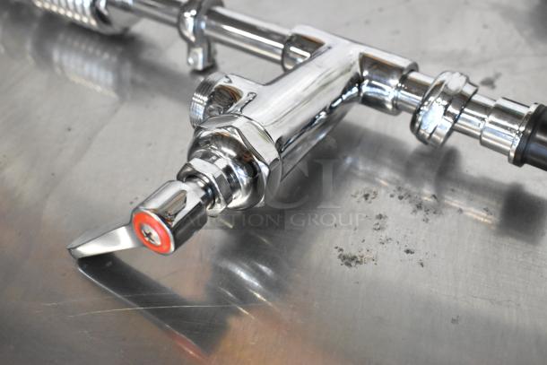 Metal spray nozzle attachment, chrome finish, excellent condition, durable construction, threaded connection visible.
