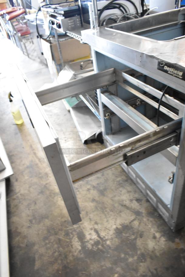Delfield UCD4432N-9M-DD1 stainless steel commercial prep table, 2 drawers, missing one drawer, 115 volts, 1 phase.