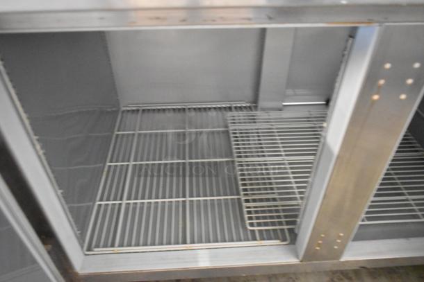 Beverage Air WTF67A stainless steel 2-door work top freezer, interior view showing wire shelves, for commercial use.