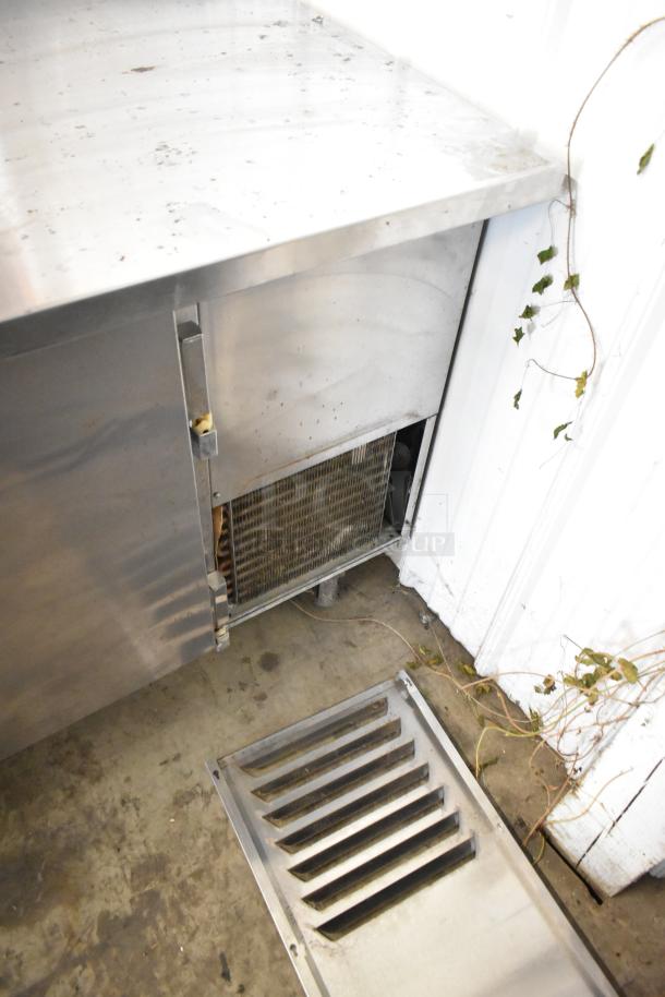 Beverage Air WTF67A stainless steel 2-door work top freezer with visible wear. Model WTF67A, 115 volts, 1 phase.