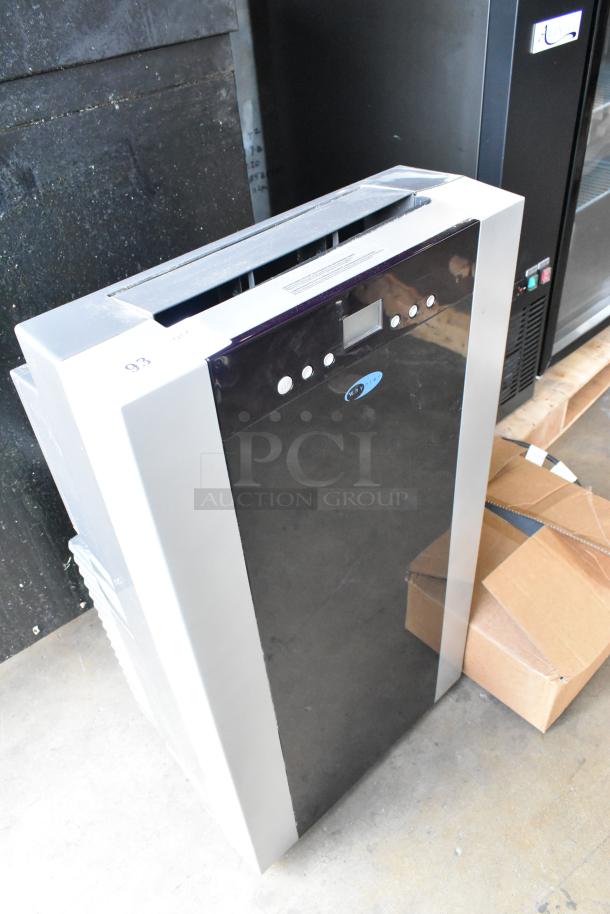 Brand new Whynter ARC-14S dual hose portable air conditioner, dehumidifier, fan; slight cosmetic scratch and dent visible.
