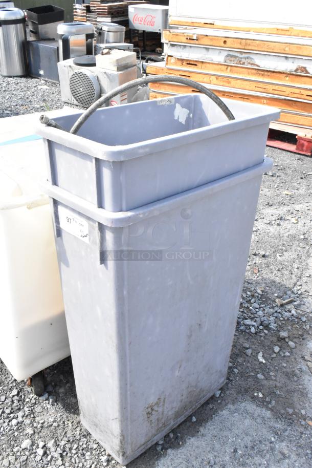 Gray Poly Slim Jimi trash can, new condition, minor scratches and dents, includes contents. Auction for two cans.