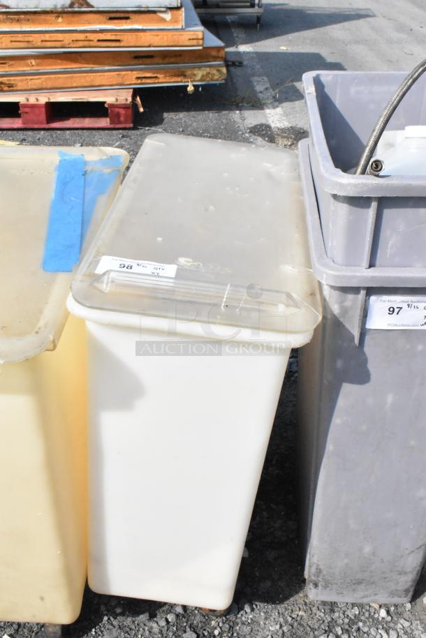 Two white poly ingredient bins on commercial casters, with lids. Labels indicate auction lot numbers.