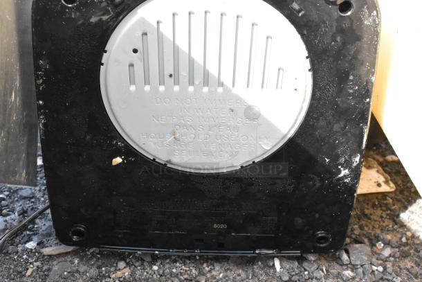 Cuisinart countertop coffee machine base view, warning text visible. 120 volts, household use.