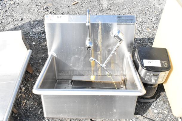 Eagle Stainless Steel Single Bay Sink, no legs, features visible faucet, some wear, label indicating brand and specifications.