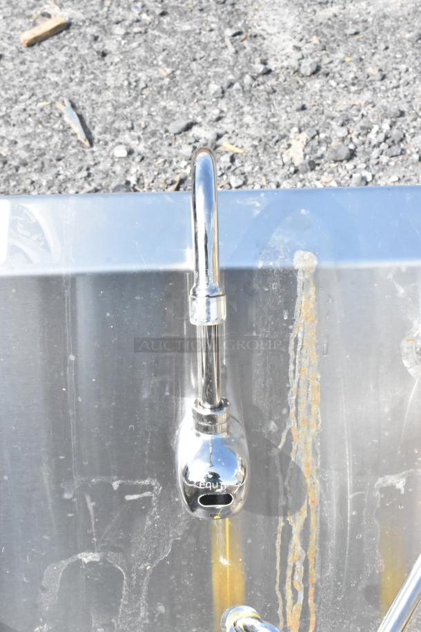 Eagle stainless steel single bay sink, no legs, visible wear, includes faucet, ideal for commercial use.
