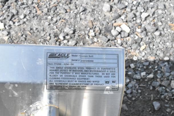 Eagle Stainless Steel Single Bay Sink, custom built, missing legs. Visible label shows model, serial number, and care instructions.