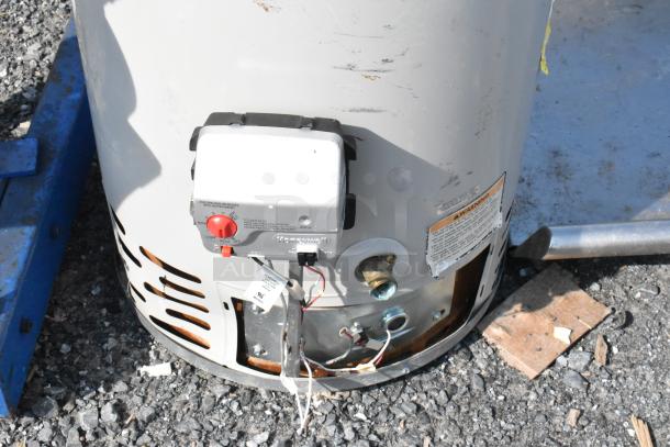 Bradford White MI40T6FBN storage water heater, natural gas, automatic, metal, visible wear, labels showing warning and controls.