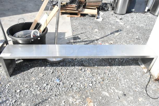 Metal over shelf, rectangular, stainless steel, slightly worn condition, sturdy design, ideal for additional storage.