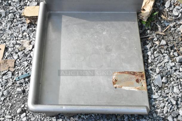 Stainless steel left side clean side dishwasher table without legs, visible surface wear, rusted mounting plate.