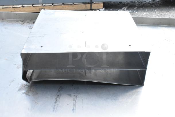Metal bin with a two-tiered design, sturdy construction. Slight wear visible, ideal for storage or industrial use.