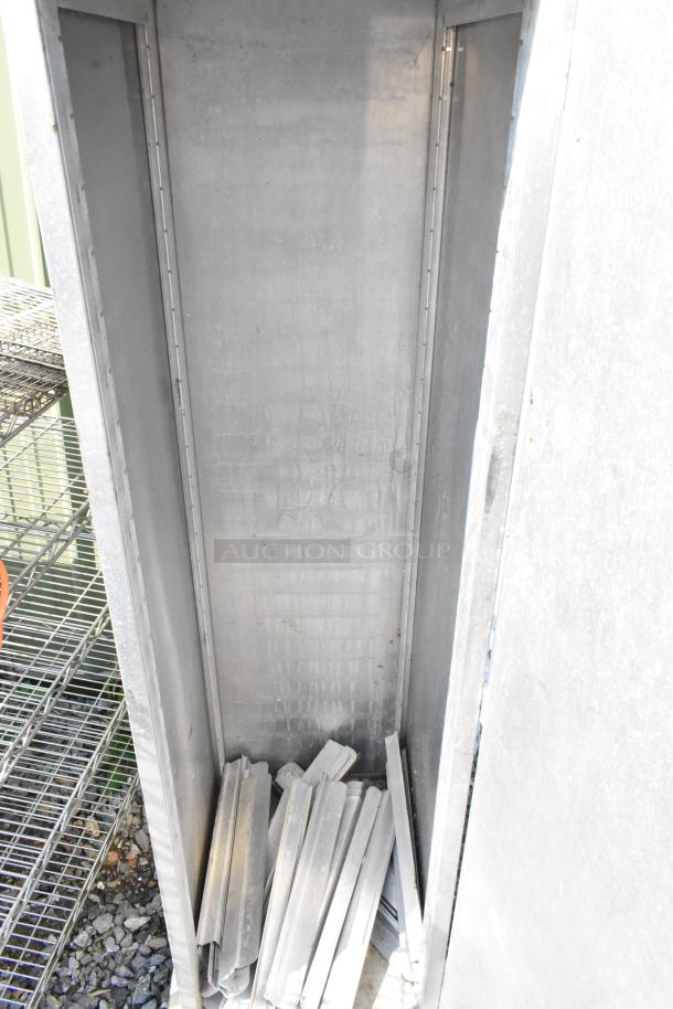 Lockwood metal commercial enclosed pan rack with open interior, visible slots, and detached door parts. Door does not stay closed.