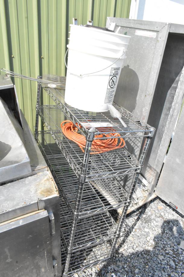 Chrome finish 5 tier wire shelving unit in used condition. Buyer must dismantle for shipping. Consider freight charges.