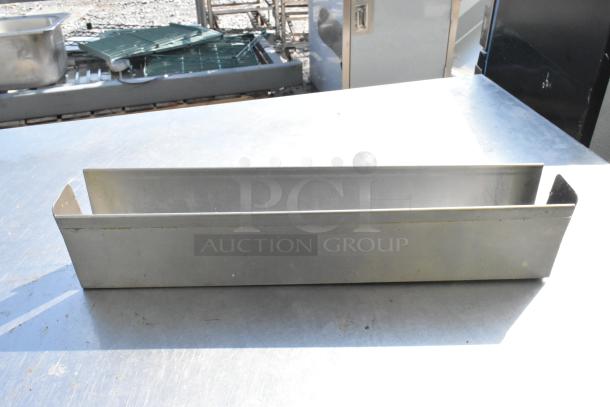 Metal rectangular object, likely part of a set of 11, with a brushed finish, visible wear, and open top. Sturdy construction.