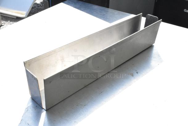 Metal piece, rectangular, silver finish, smooth texture, used condition with minor wear. One of 11 pieces in auction.