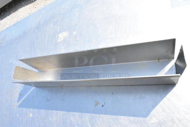 Metal piece with clean, sharp edges and a U-shaped profile. Appears new, with a smooth, reflective surface. No visible labels.