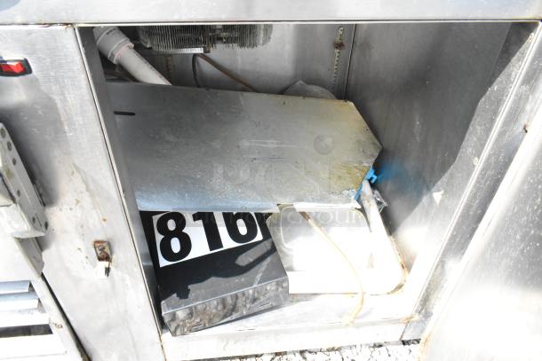 Universal Coolers SC48BM stainless steel prep table. Visible interior components. Some wear. 115 Volts, 1 Phase.