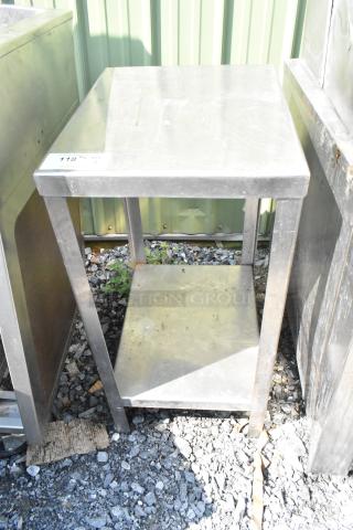 Metal table with under shelf, used condition. Visible wear on surface. Tag reads "118 Qty 1." Ideal for storage or workspace.