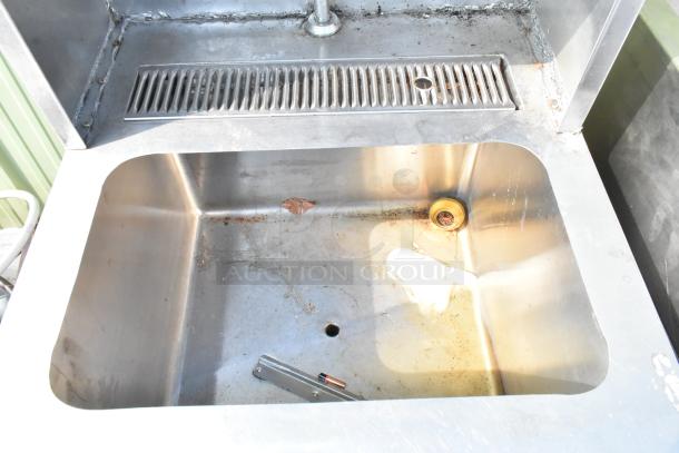 Stainless steel single bay sink with water dispenser, includes 2-tier over shelf and under shelf, moderate wear visible.
