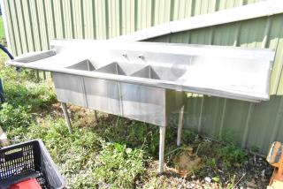 Marlo stainless steel 3 bay sink with dual drain boards, outdoor setting, good condition, ideal for commercial kitchen.