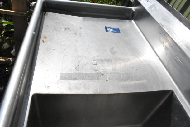 Marlo stainless steel 3 bay sink with dual drain boards, lightly worn, visible small scratches and minor stains.