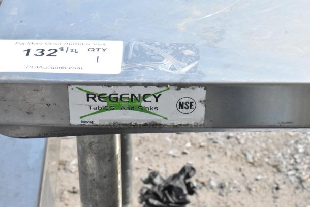 Regency stainless steel table with metal under shelf, visible labels and NSF certification.