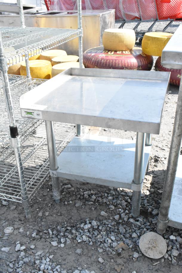 Regency 600ES2424G stainless steel equipment stand with metal under shelf, NSF certified, visible wear, suitable for commercial use.