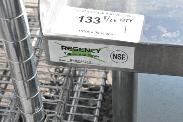 Regency 600ES2424G stainless steel equipment stand with metal under shelf, NSF certified, model label visible.