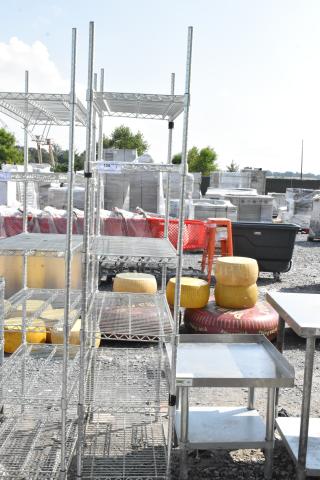 Chrome finish 6-tier wire shelving unit for auction. Sturdy design, slight wear. Buyer must dismantle; freight charges apply.