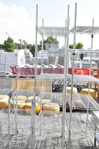 Chrome finish 6-tier wire shelving unit outdoors, dismantling required, freight charges apply, PCI cannot dismantle.