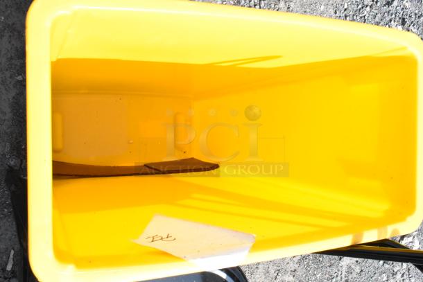 Lavex Yellow Poly Slim Jim Trash Can, rectangular, open top, slightly scuffed interior; suitable for commercial use.