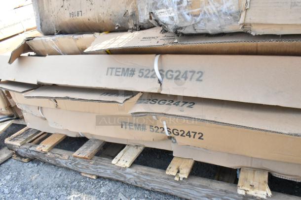 Cardboard boxes of 522SG2472 Steelton equipment stands, some damaged. Boxes on wooden pallet, indicating new items with scratches.