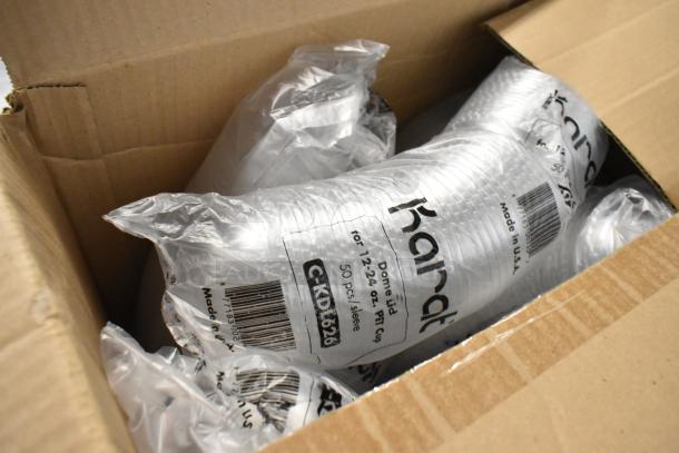 Alt text: Karat C-KDL626 dome lids in original box, brand new, for 12-24 oz PET cups. Packaging shows "50 pcs/sleeve."