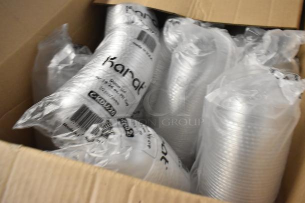 Brand new Karat C-KDL626 dome lids for 12-24 oz PET cups, packed in box, labeled with product details and barcode.