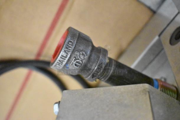 Close-up of a metal connector, labeled "TAILAND," part of a 2024 Blodgett Zephaire-200-G-ES convection oven.