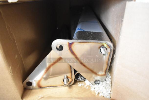 Metal components in a cardboard box, possibly parts for a Blodgett DFG100 convection oven.