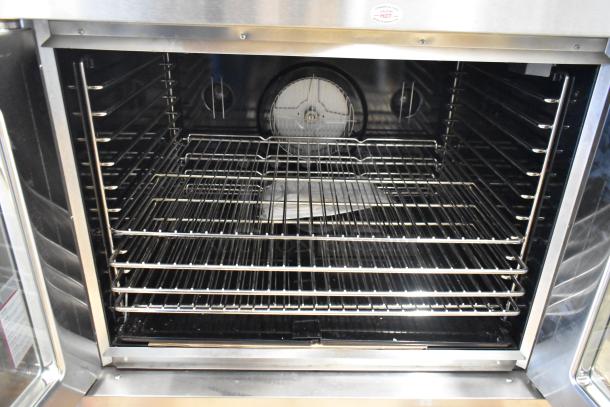 Brand new 2016 Blodgett DFG100 stainless steel commercial convection oven, view-through doors, metal racks, thermostatic controls.