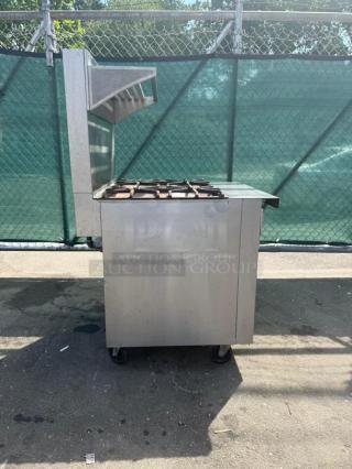 Southbend P32D-XX Platinum 4 Burner Range, 32" wide, 180k BTU, steel, on wheels, used condition, auction label visible.