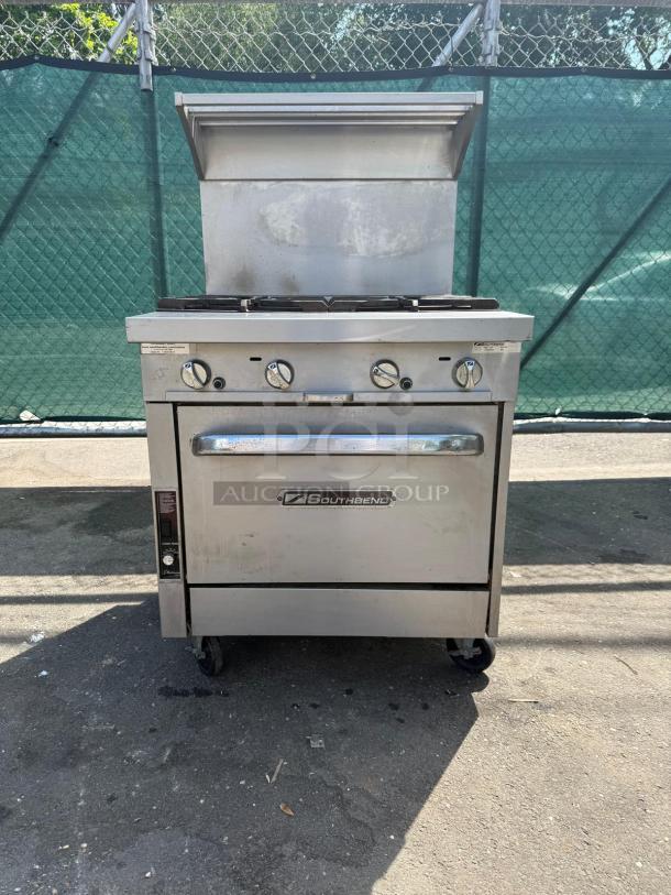 Southbend P32D-XX Platinum Series 4-burner range, 32" wide, 180k BTU, chrome knobs, stainless steel, visible wear.