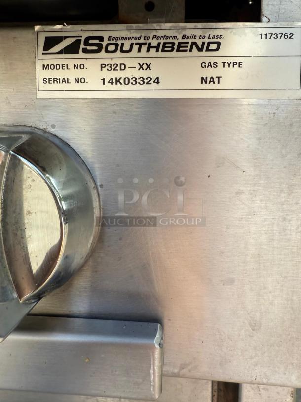 Southbend P32D-XX heavy-duty range, 32" wide, 4 burners, 180k BTU. Label shows model and serial number: 14K03324.