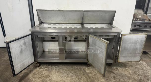 Leader Commercial Undercounter 3 Door Refrigerator with worktop, stainless steel, open doors, used condition.