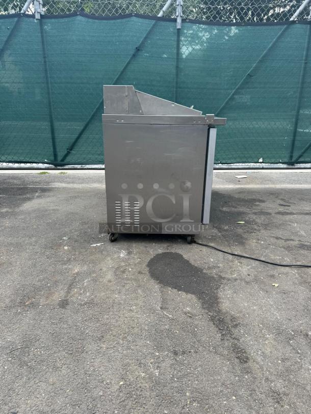 Kelvinator Commercial KCHMT48.18 48" prep table, stainless steel, refrigerated base, visible wear, 115v, on casters.