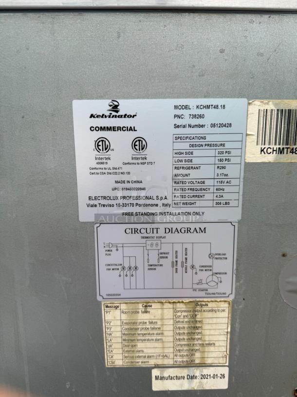 Kelvinator KCHMT48.18 label with model, serial number, voltage info, and manufacturing details.