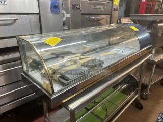 Brand new refrigerated display case, still in box. Ideal for sushi or bakery. Clear glass, stainless steel base.