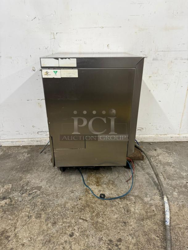 Lamber Deluxe undercounter dishwasher, stainless steel, 30 racks/hr, 208-240v, used, showing signs of wear.